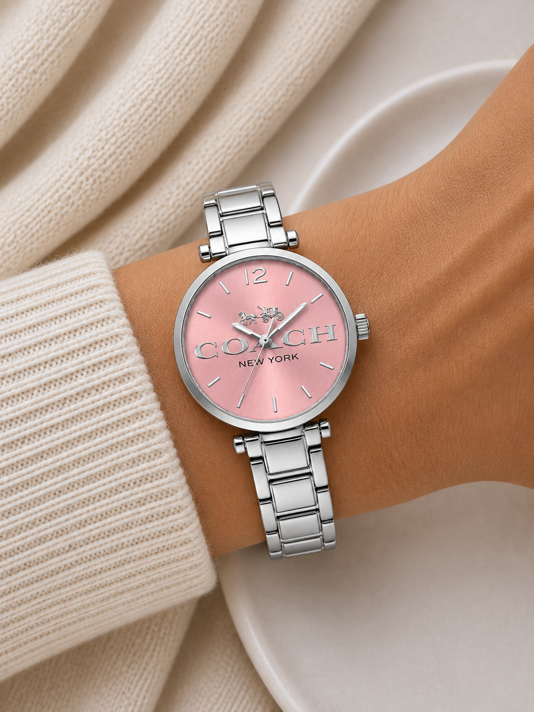 Reloj Coach Plateado Fondo Rosado